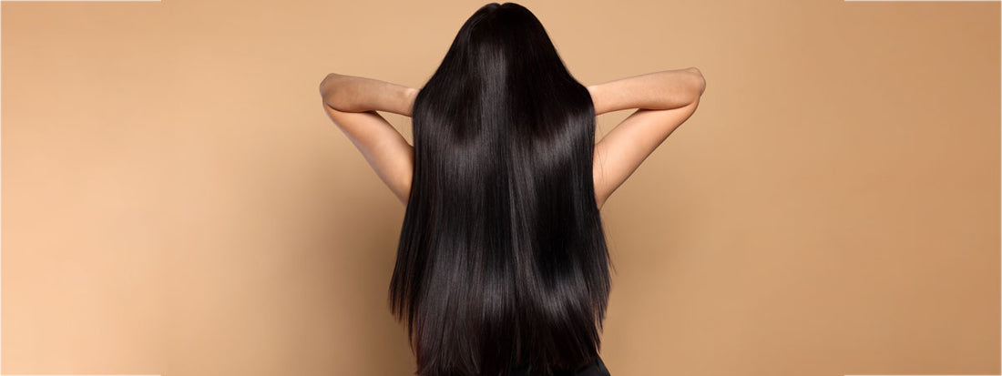A person with long, straight black hair facing away from the camera.