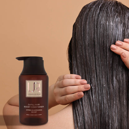 Brown hair conditioner bottle with a person holding wet hair against a beige background